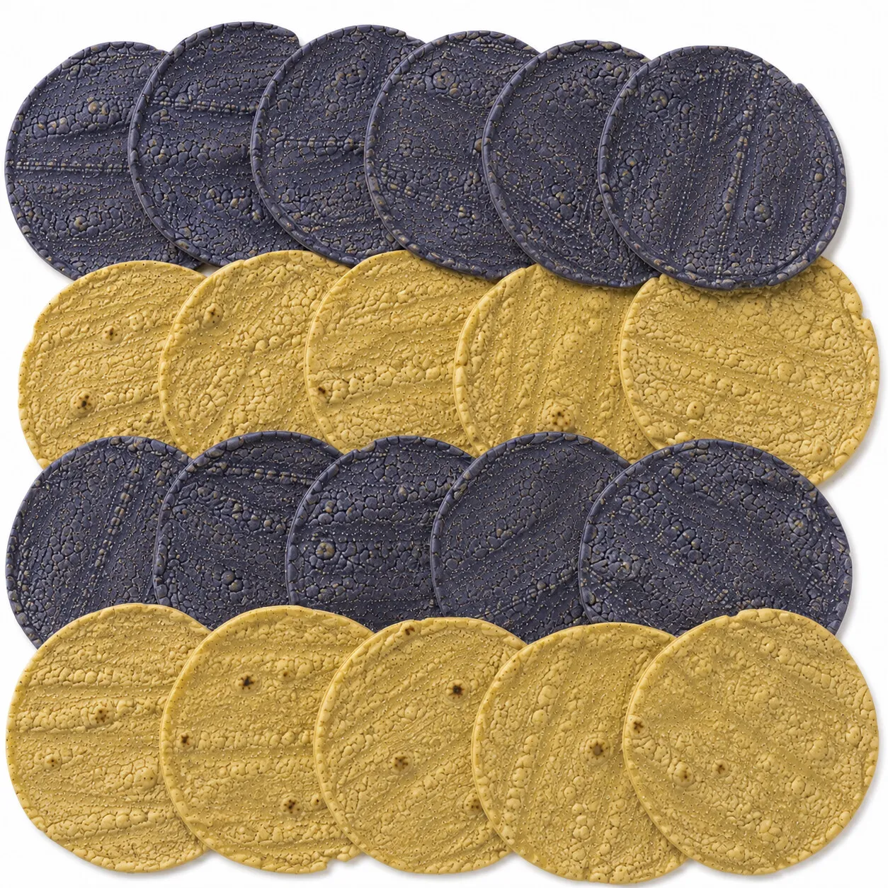 Rows of blue and yellow corn tortillas, layered